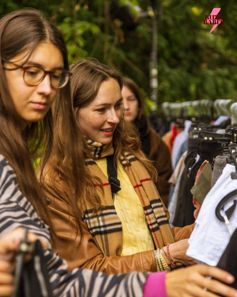 People browsing vintage clothing at a Buzz Babes flea market event