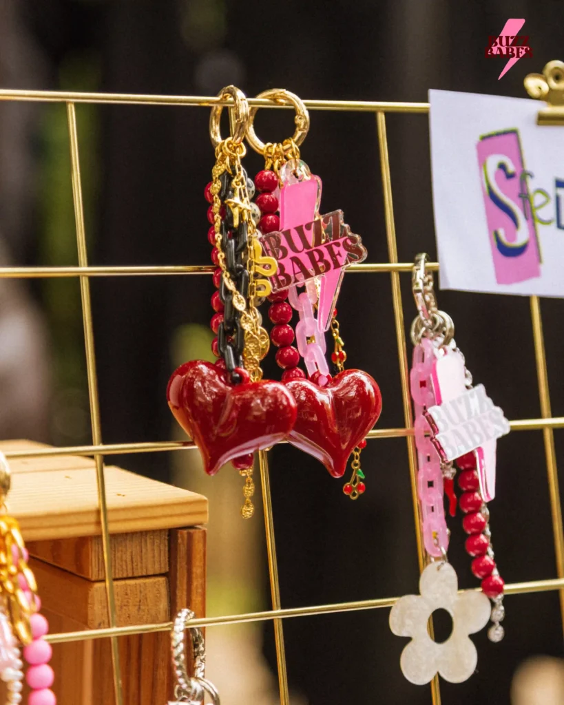 Handmade accessories and jewelry displayed at a Buzz Babes flea market event