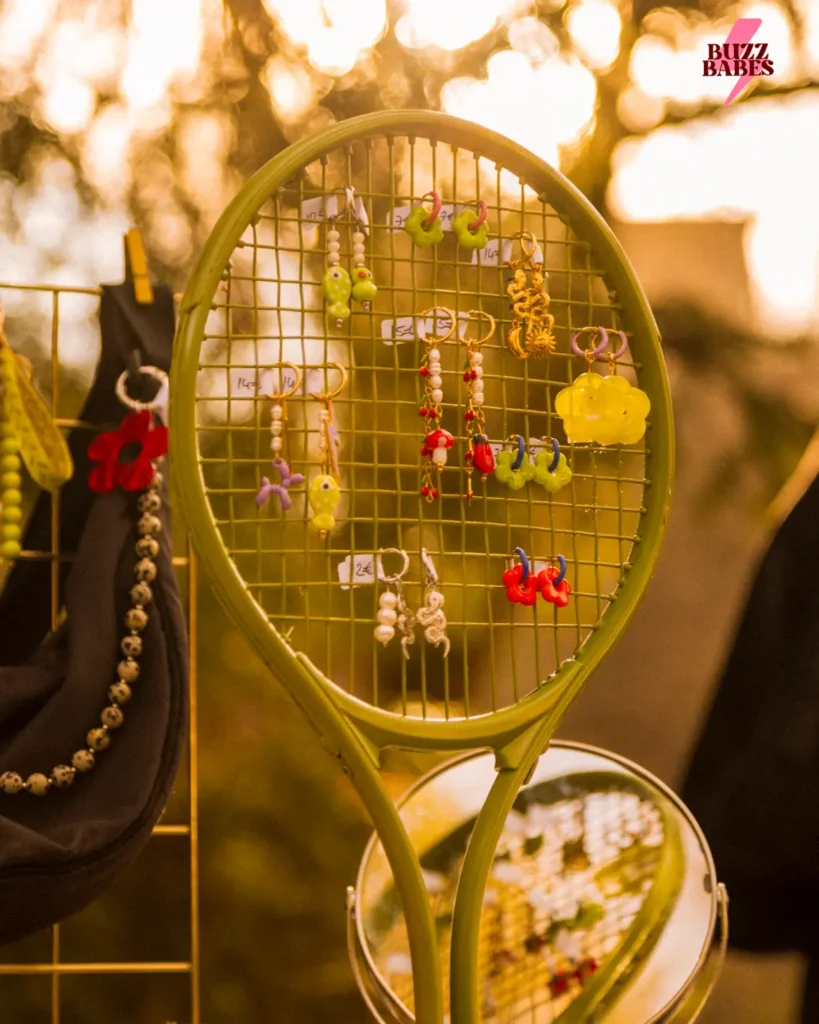 Handmade earrings displayed at a Buzz Babes market