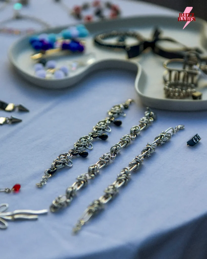 Handmade jewelry displayed at a Buzz Babes market