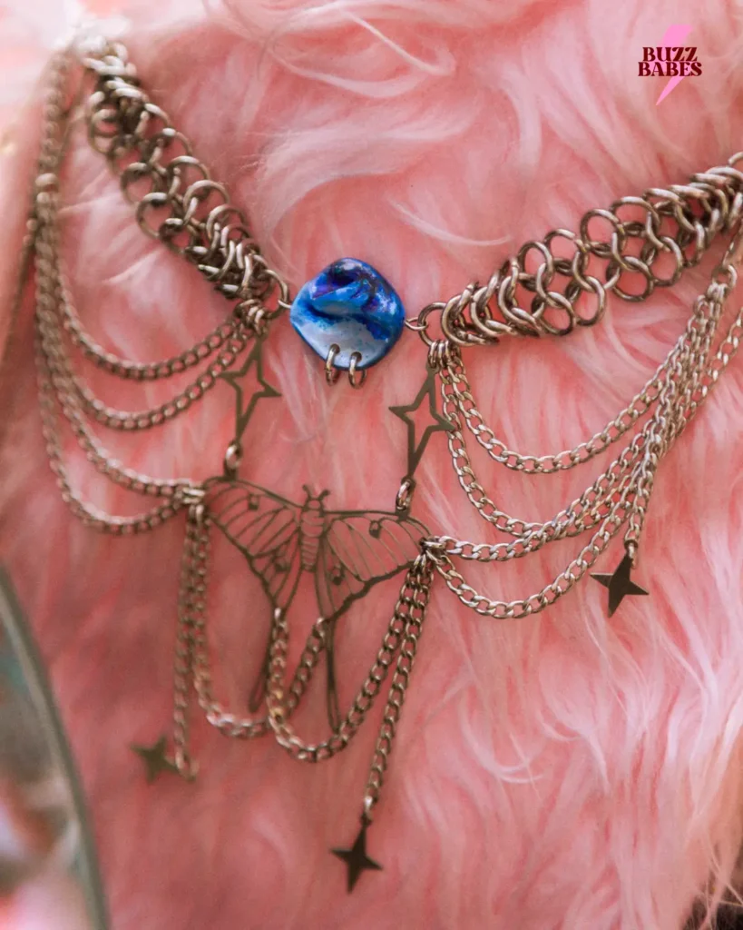 Close-up of a handmade necklace at a Buzz Babes event