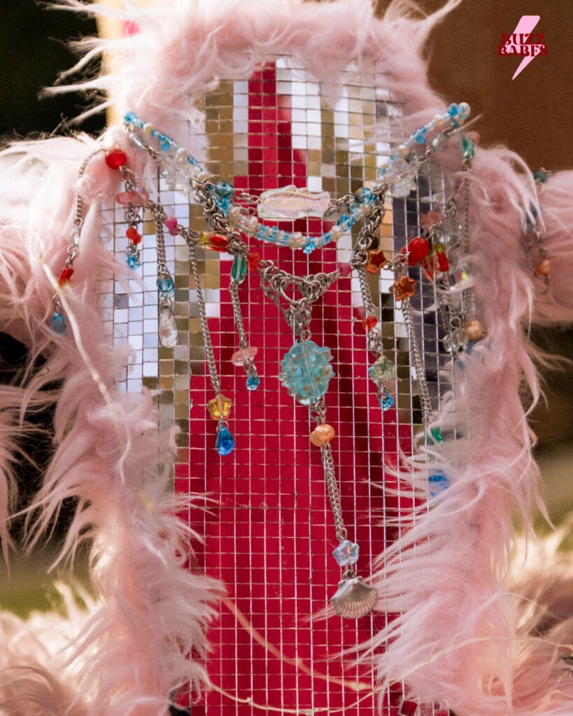 Handmade statement necklace displayed at a Buzz Babes market